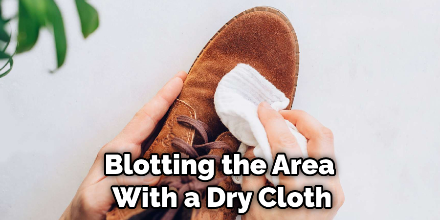 Blotting the Area With a Dry Cloth