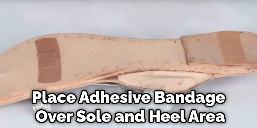 Place Adhesive Bandage Over Sole and Heel Area