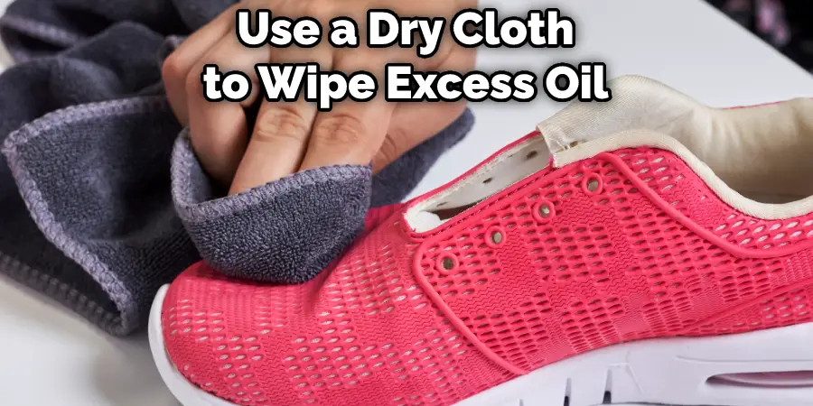Use a Dry Cloth to Wipe Excess Oil