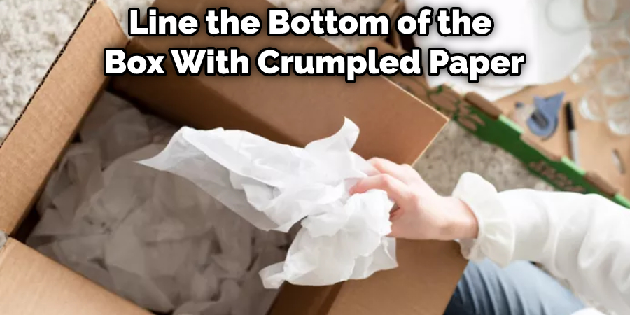 Line the Bottom of the  Box With Crumpled Paper