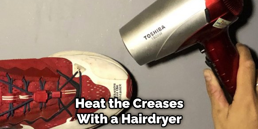 Heat the Creases With a Hairdryer