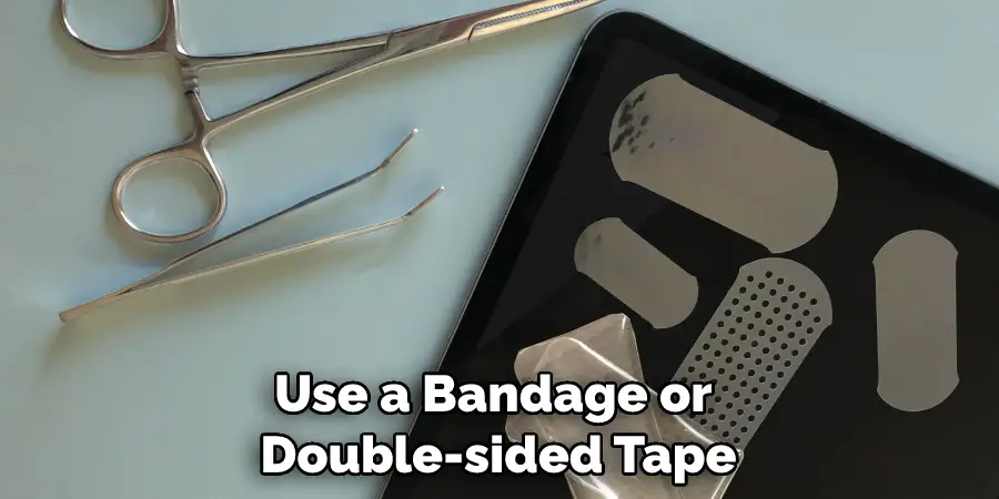 Use a Bandage or Double-sided Tape