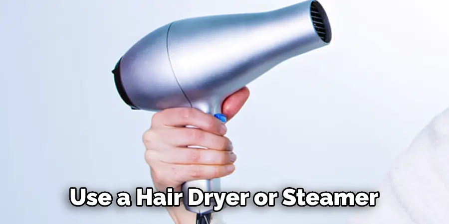  Use a Hair Dryer or Steamer
