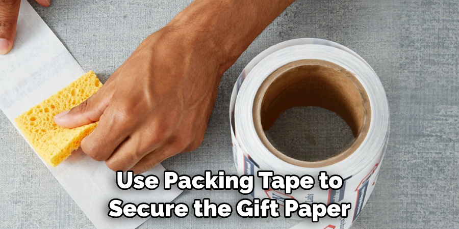 Use Packing Tape to Secure the Gift Paper