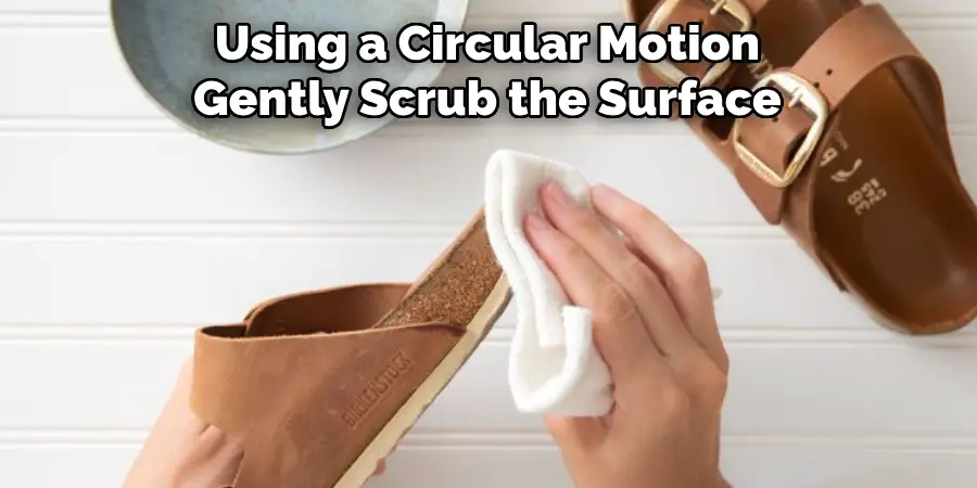 Using a Circular Motion Gently Scrub the Surface