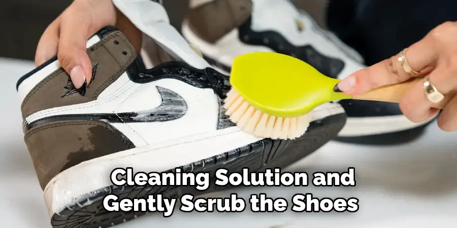  Cleaning Solution and Gently Scrub the Shoes